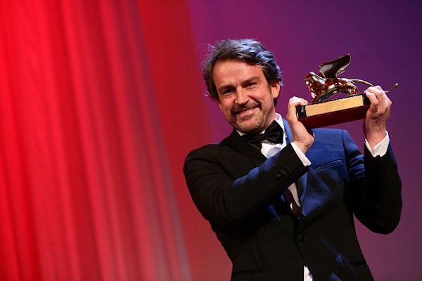 VENICE, ITALY - SEPTEMBER 12: Director Lorenzo Vigas on stage with the Golden Lion Award for Best Film for 'From Afar' at the closing ceremony during the 72nd Venice Film Festival on September 12, 2015 in Venice, Italy. (Photo by Vittorio Zunino Celotto/Getty Images)